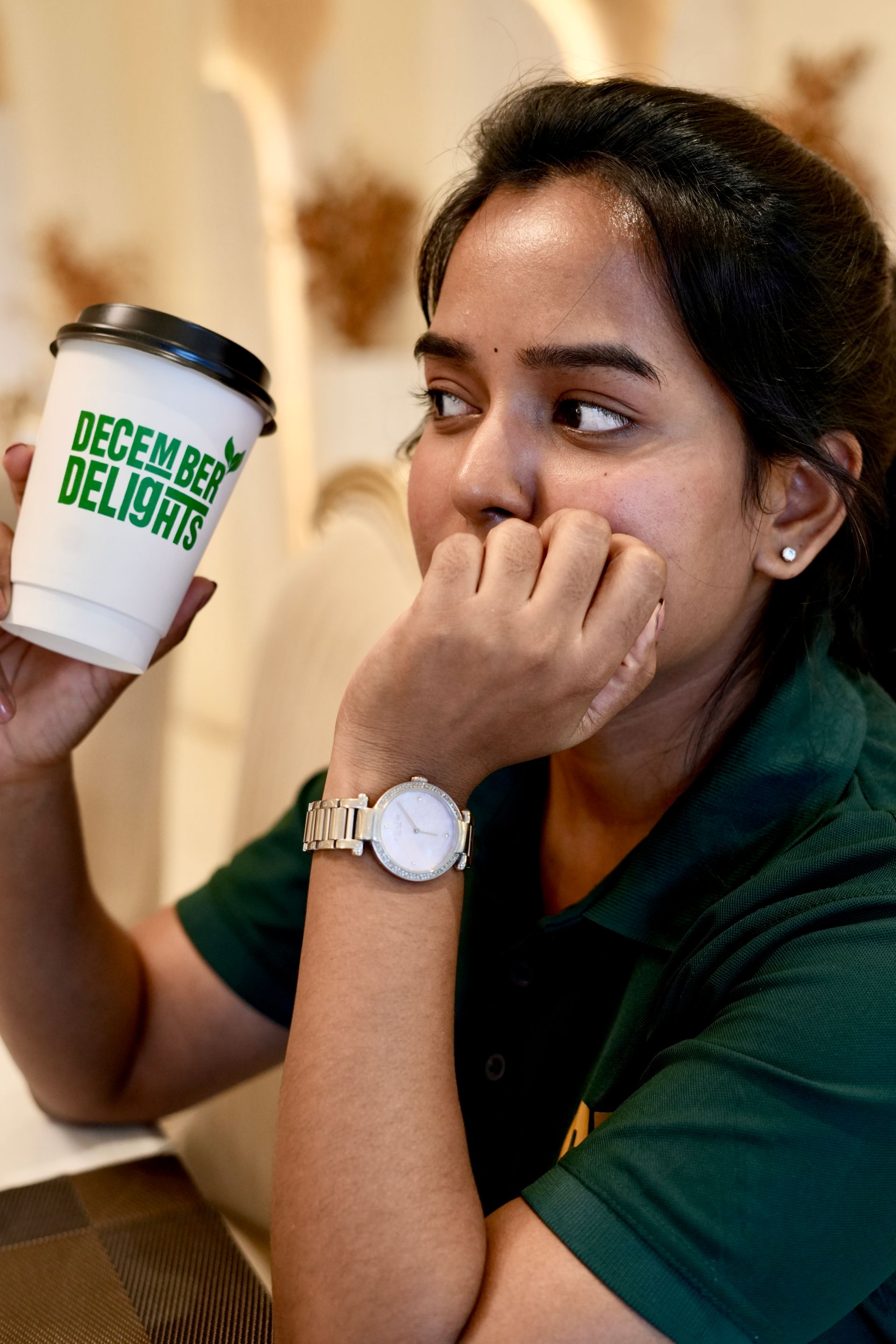 Owner with December Delights cup